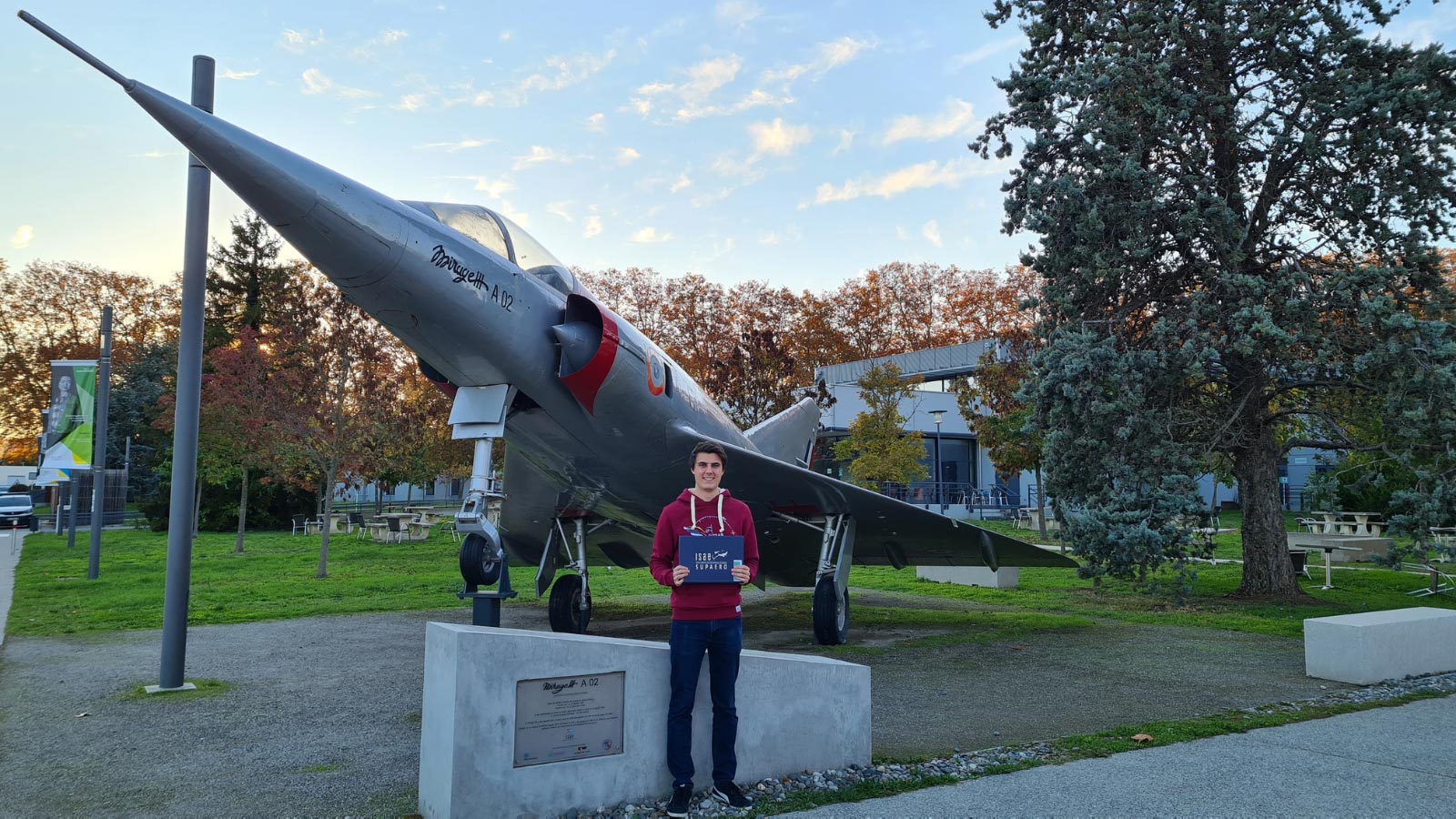 Space scholarship program sparks a star change - Scholarship recipient in front of an aircraft