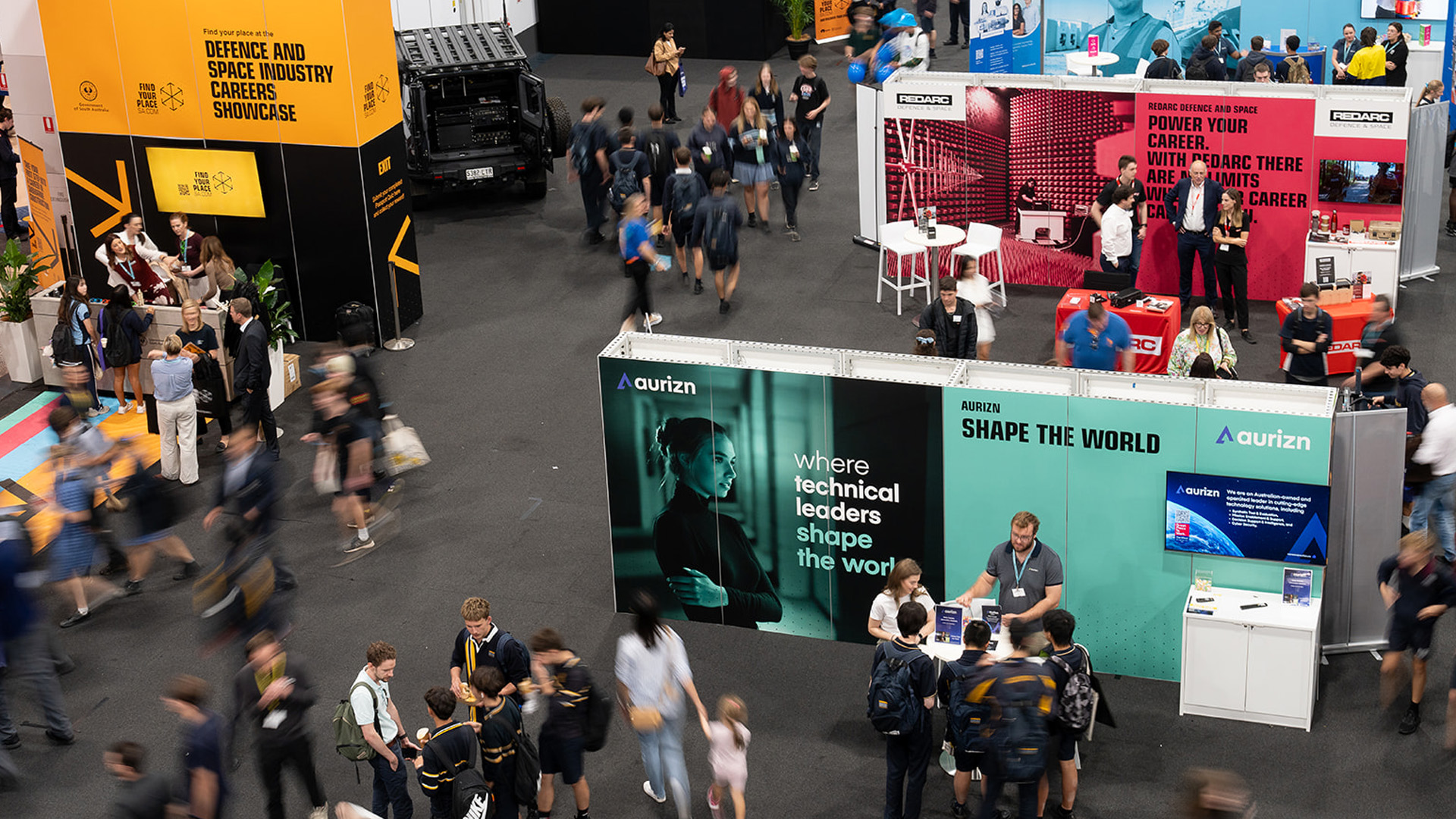 People engaging with exhibitors at the inaugural Defence and Space Industry Careers Showcase in Adelaide, held during the 2025 Careers & Employment Expo at the Showgrounds.