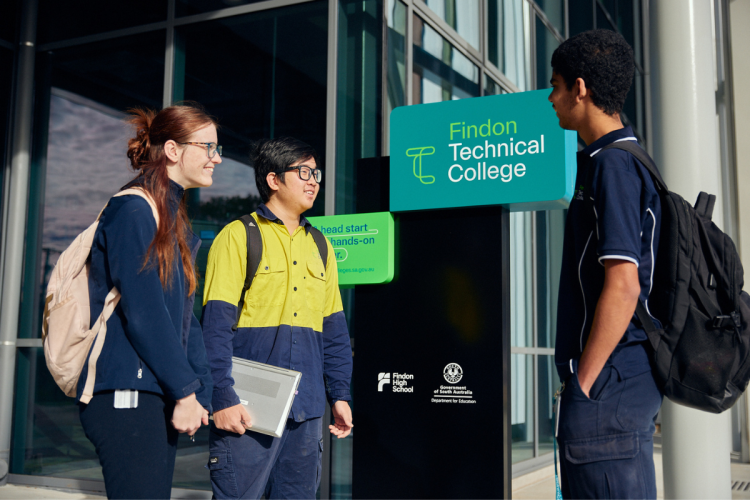 Students outside of Findon Technical College with signage 