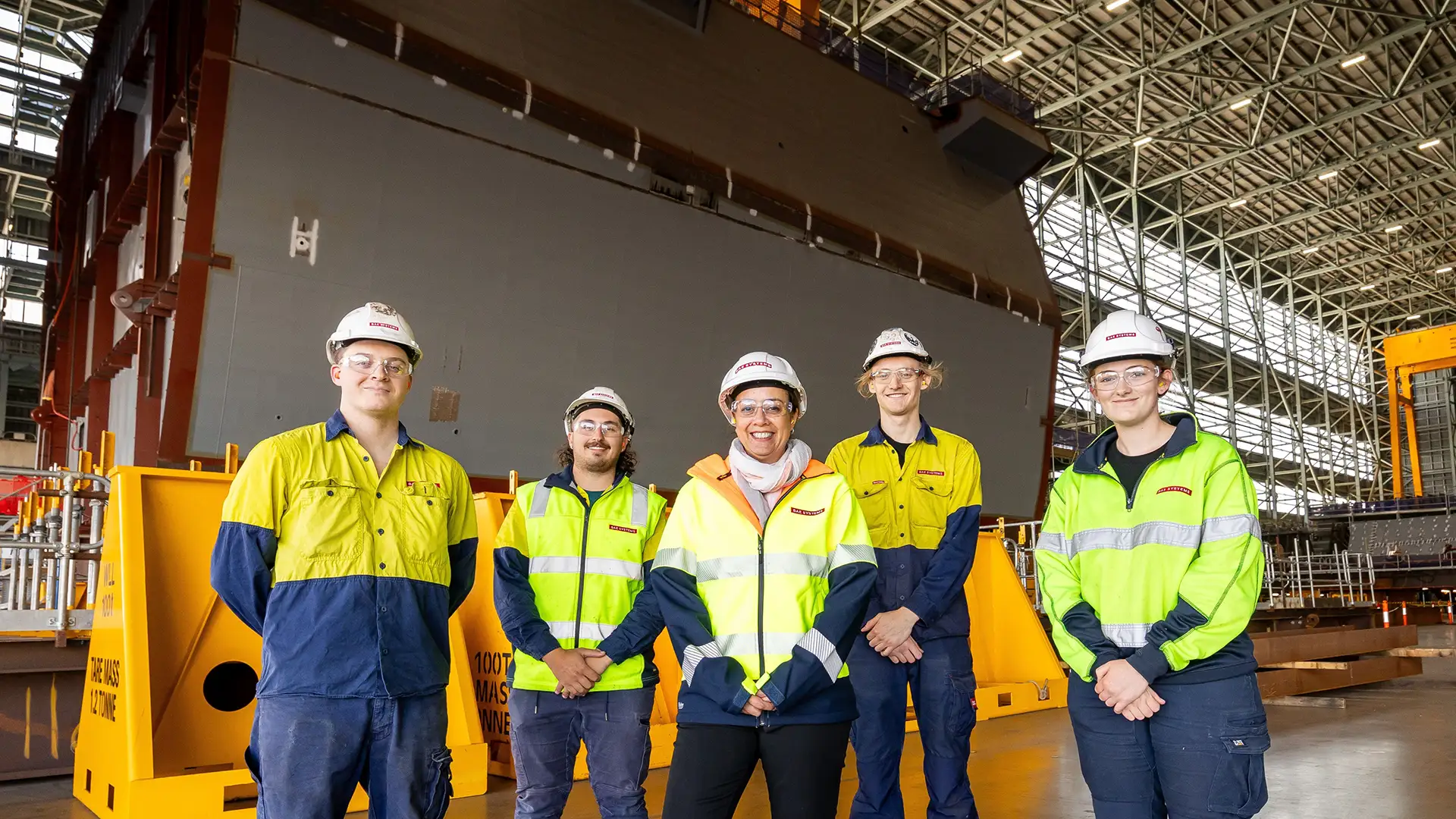 Ronan, Adrian, Georgette, John, Izzy in front of Prototype Blocks 10 & 16 in Building 22 (Block Outfitting and Erection Hall)