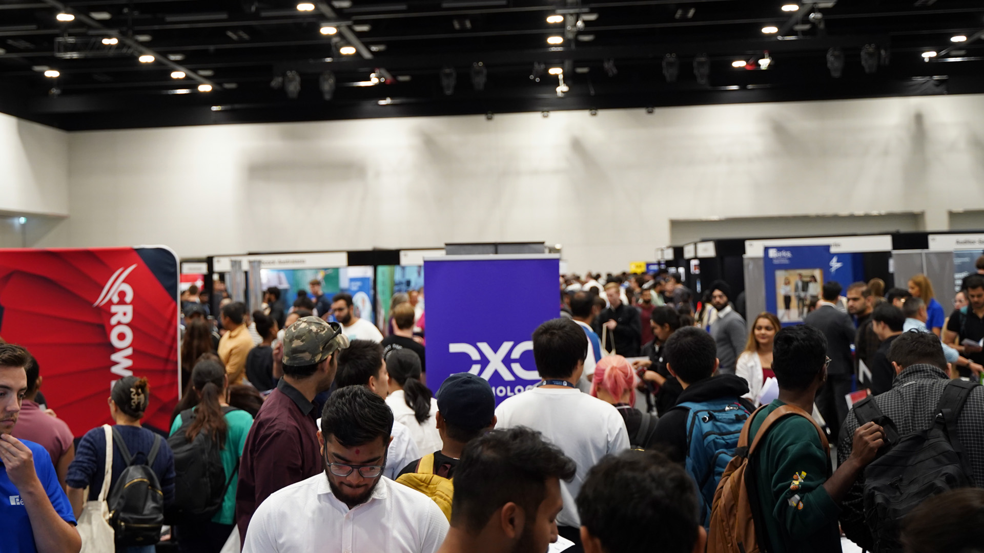 Large room with groups of students exploring career pathways